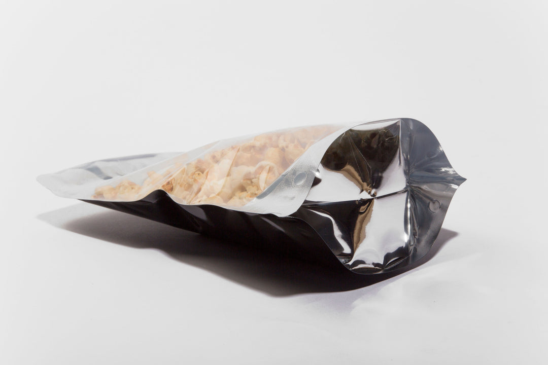 Clear/Foil/Black Stand Up Pouches With Resealable Zip & Tear Notch - Titan Packaging