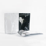 Load image into Gallery viewer, Metallic Black, Silver &amp; White Stand Up Pouches 1KG With Zip &amp; Tear Notch - Titan Packaging